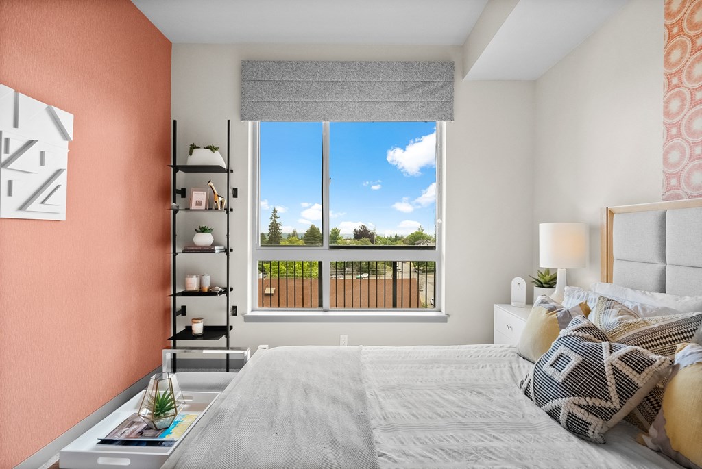 a bedroom with a bed and a window with a view