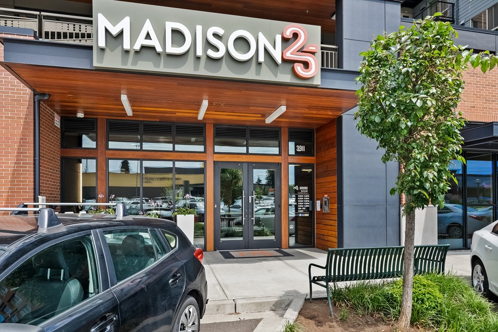 the front of madison 3 with cars parked outside