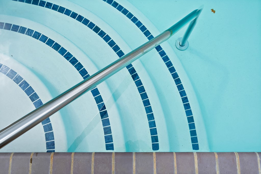 a close up of a blue umbrella with a metal handle