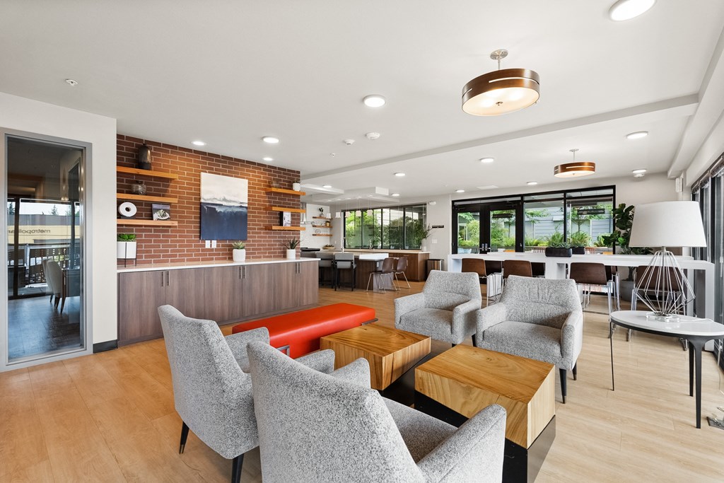 the lobby of a restaurant with chairs and tables