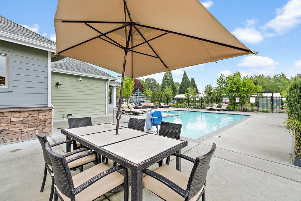 our 2400 2400 patio has a table and chairs and a pool
