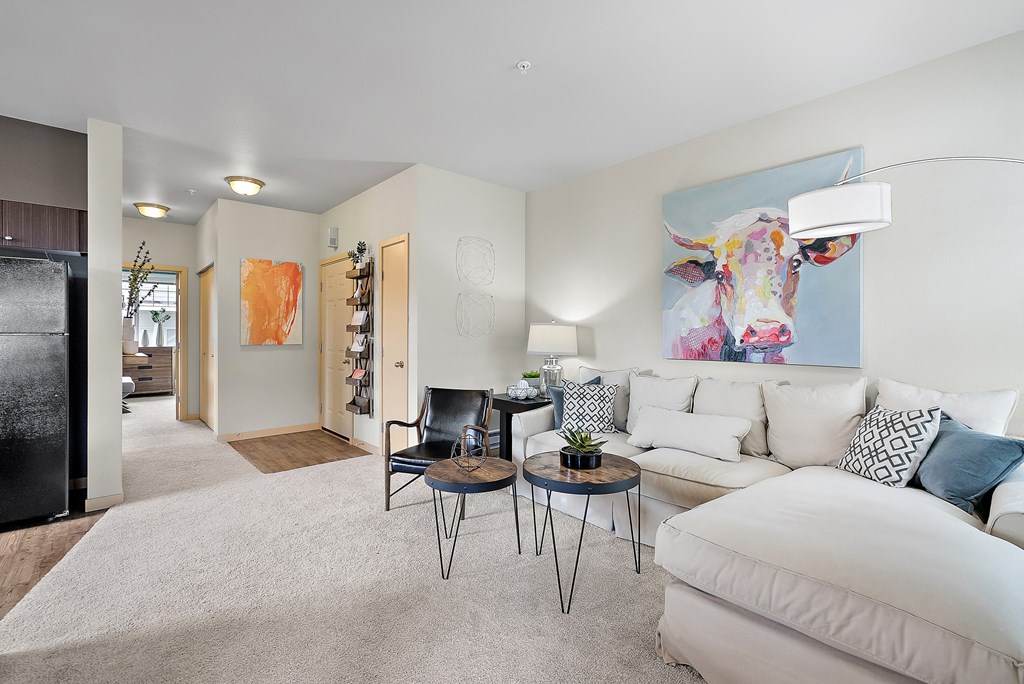 a living room with a white couch and a table