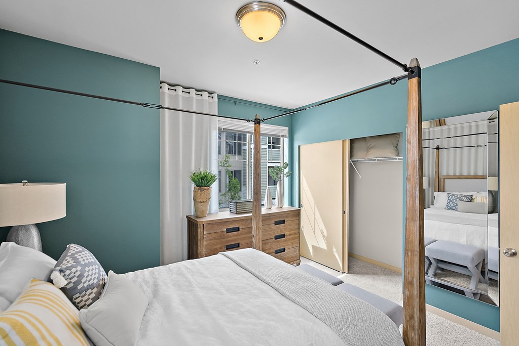 a bedroom with a bed and a closet