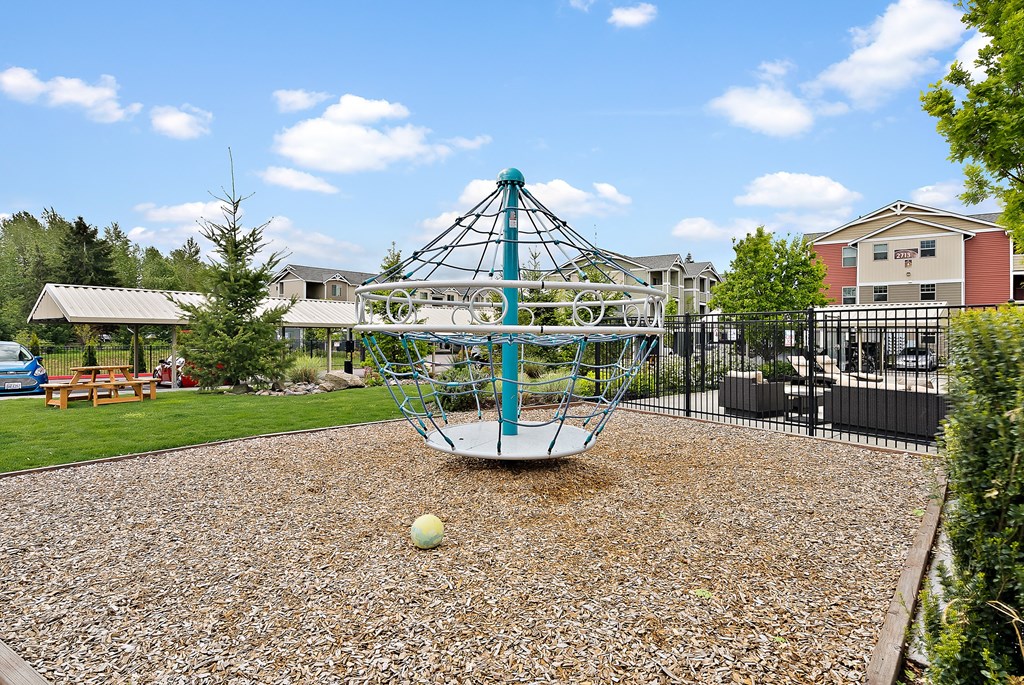the preserve at ballantyne commons playground with a swing set and a playground ball