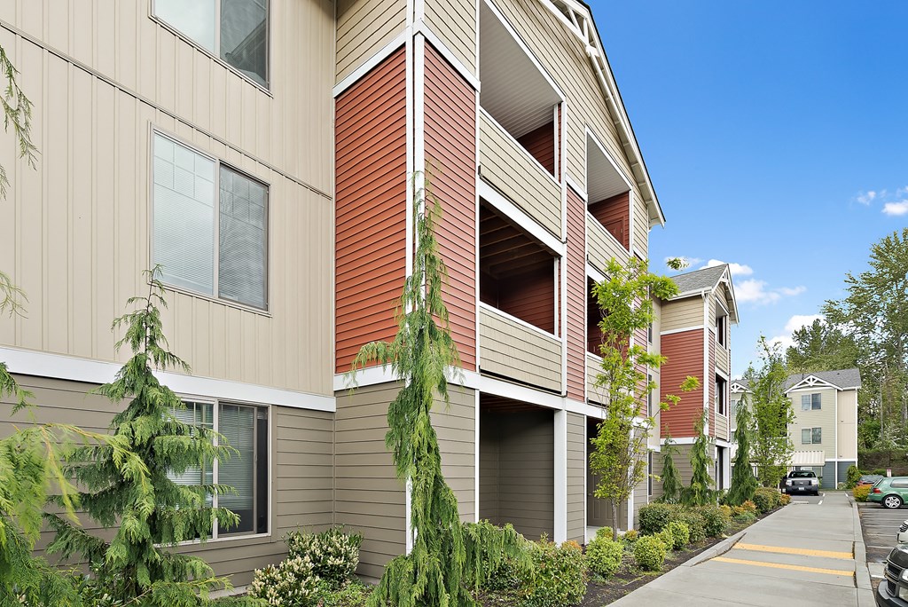 a view of the exterior of a condo building with a sidewalk