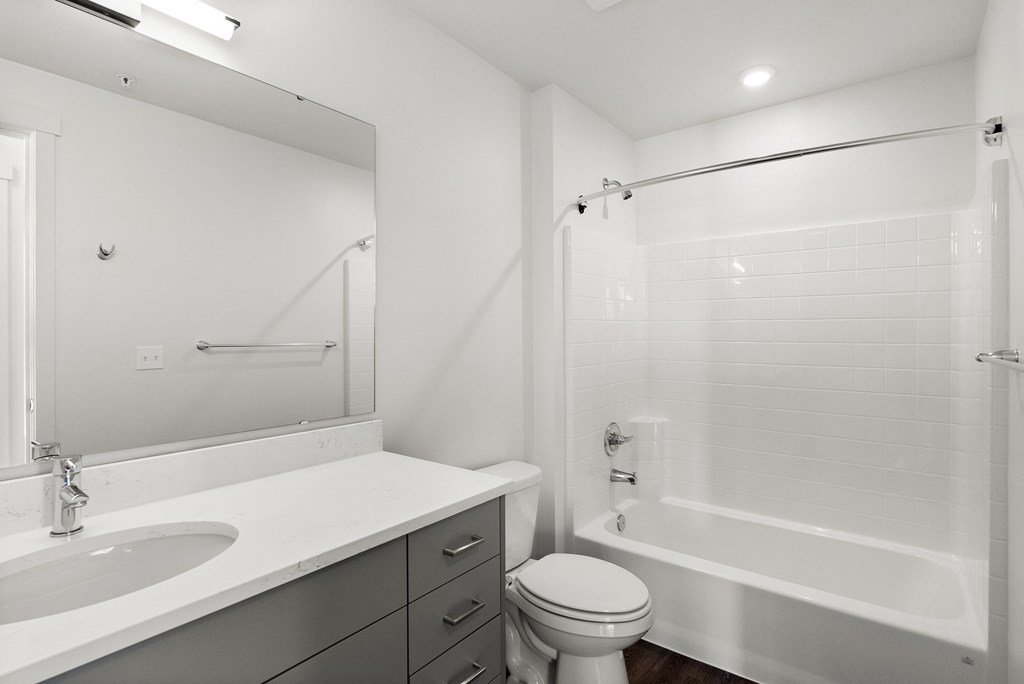 a bathroom with a bathtub and a sink