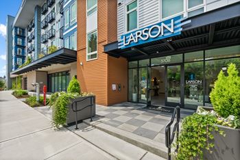 The exterior of a building with the name Larson on it.