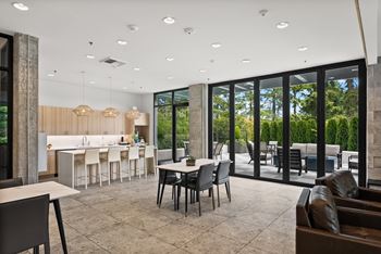 A modern dining room with a table set for six.