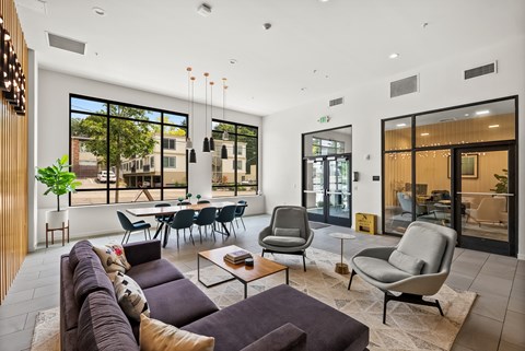 A modern living room with a large couch and a coffee table.