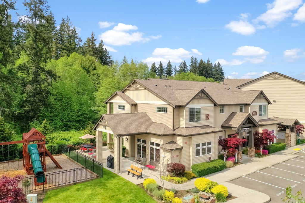 a house with a playground on the side of it