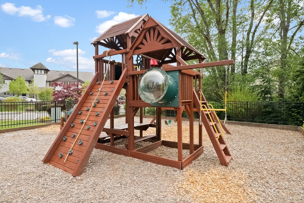 a wooden playset with a telescope and a glass globe on it