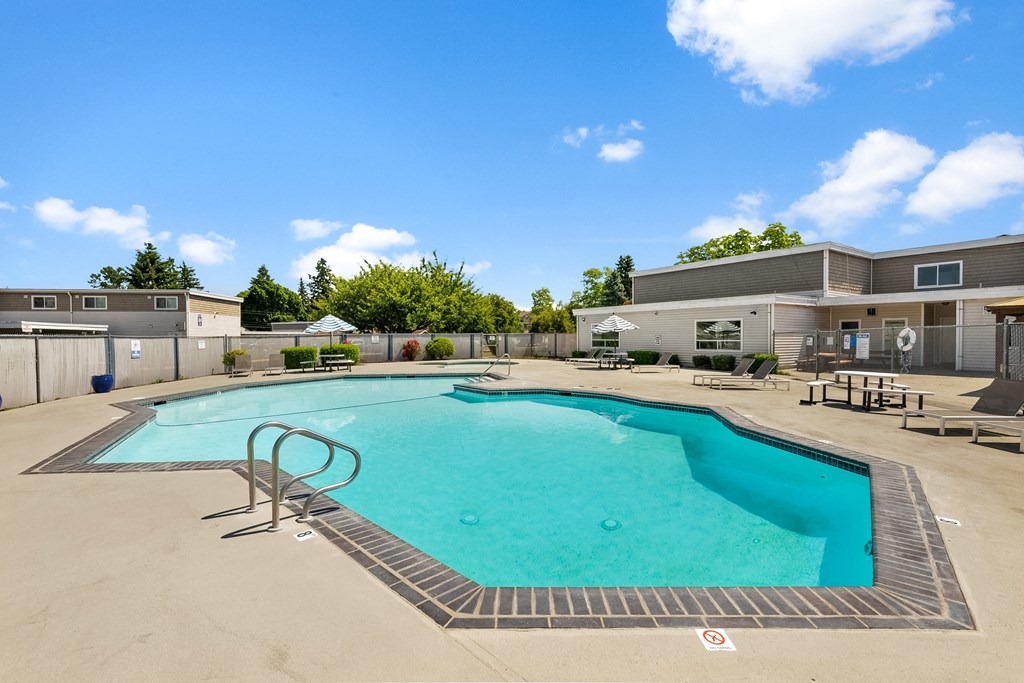 our apartments have a resort style swimming pool with seating around it