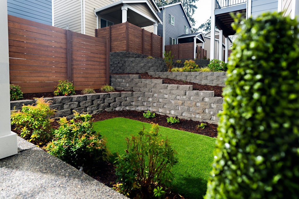a retaining wall in front of a house