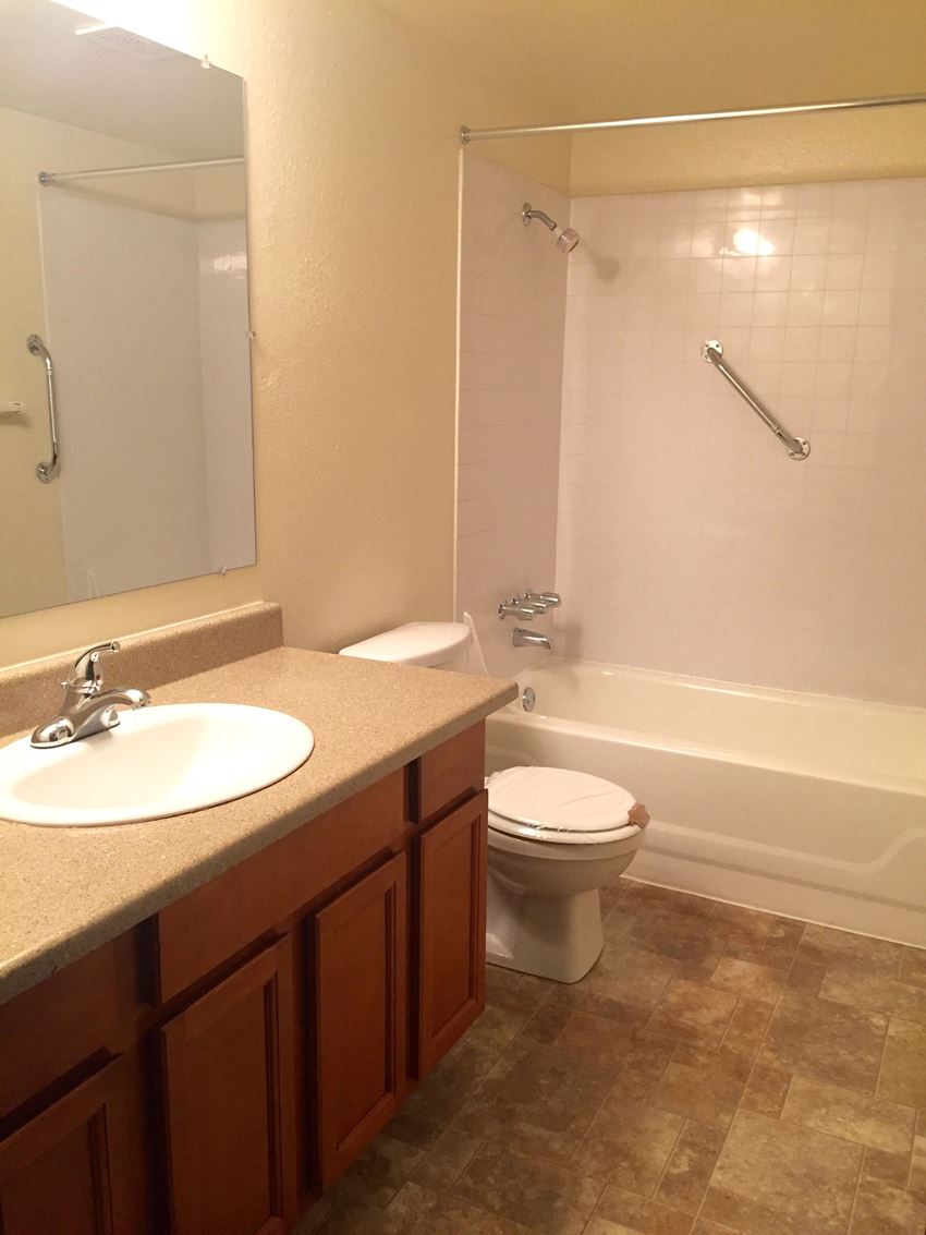 a bathroom with a sink toilet and bath tub