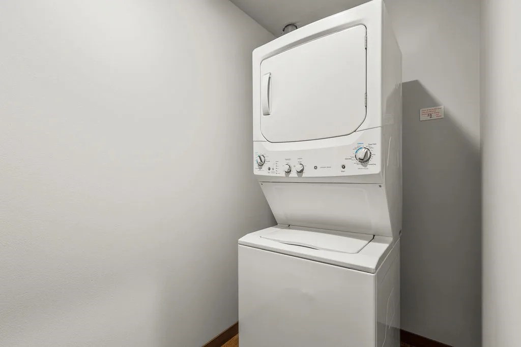 A white oven with a stove top and a microwave built in.