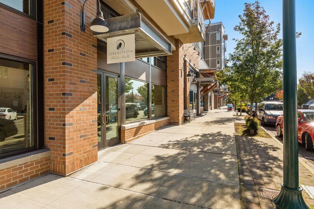 A street view of a building with a sign that reads "Serenity".