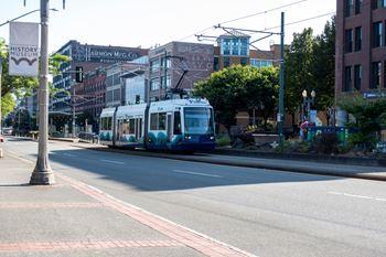 A street with a tram on the road.