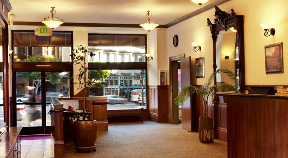 the lobby of a hotel with a view of the street