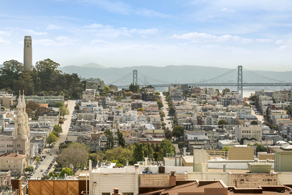 a view of the city and the ben franklin bridge