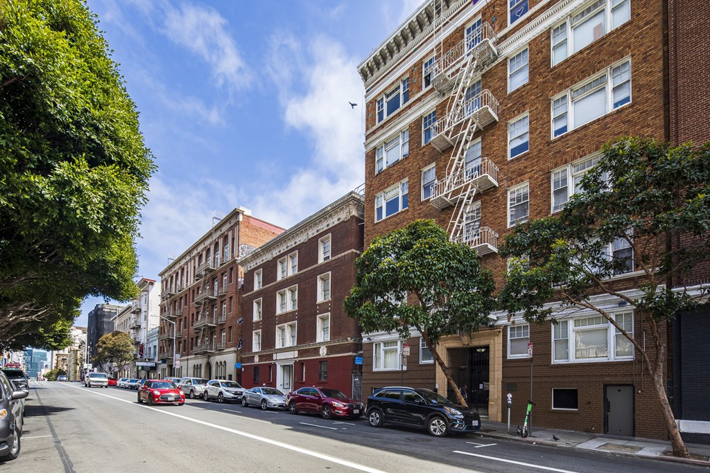 a view of a city street with brick buildings