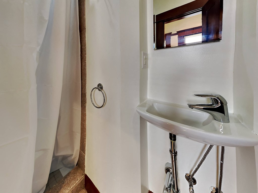 a bathroom with a sink and a mirror