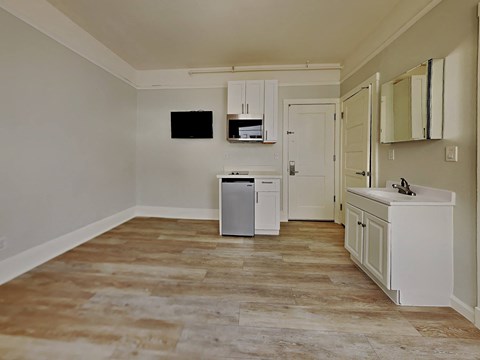 a kitchen with a dishwasher and a sink and a refrigerator