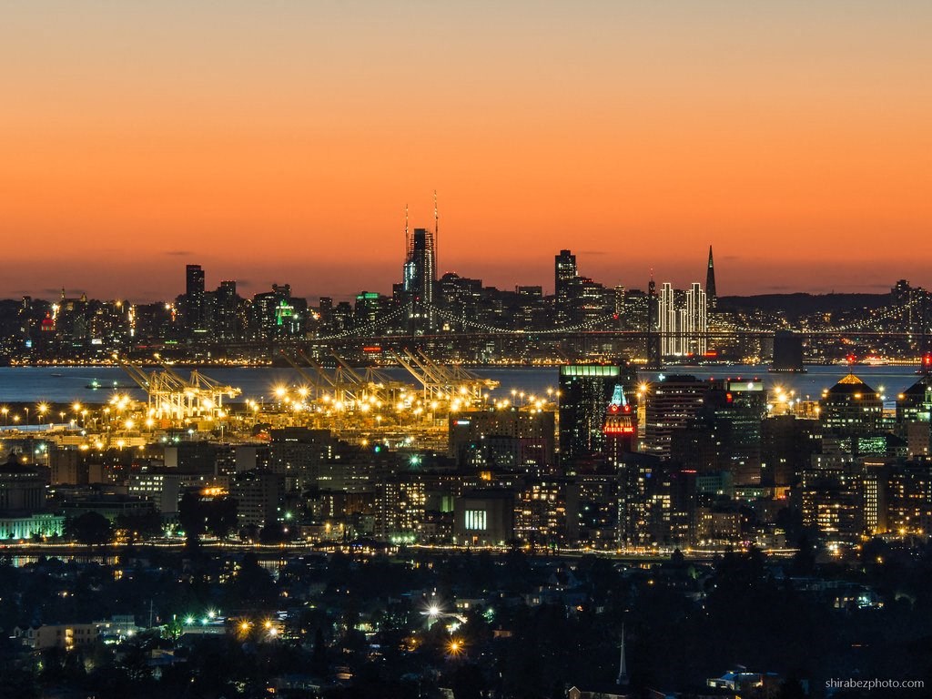 a night view of the city and bridge