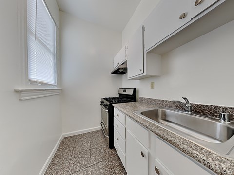 a kitchen with granite counter tops and a sink