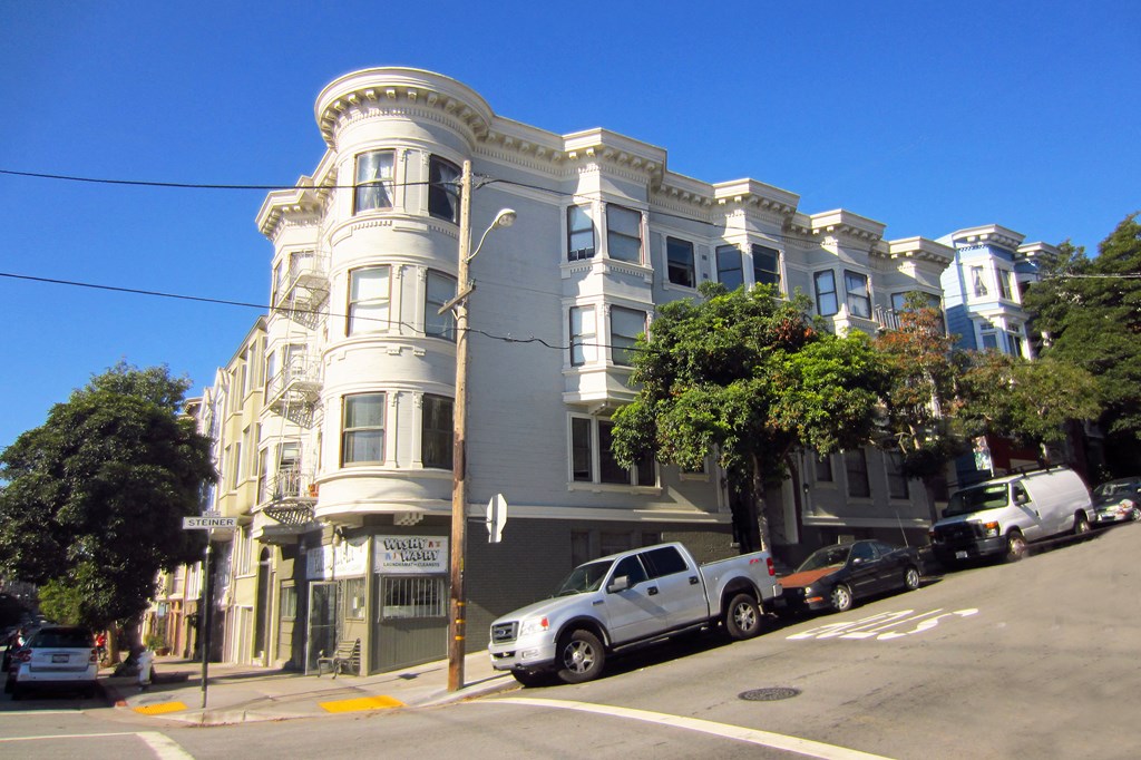 a building on the corner of a city street