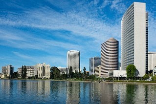a group of tall buildings next to a body of water
