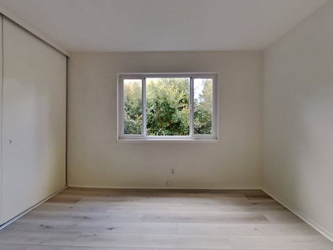 an empty room with a window in it