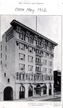 an old photo of a building with a sign on it