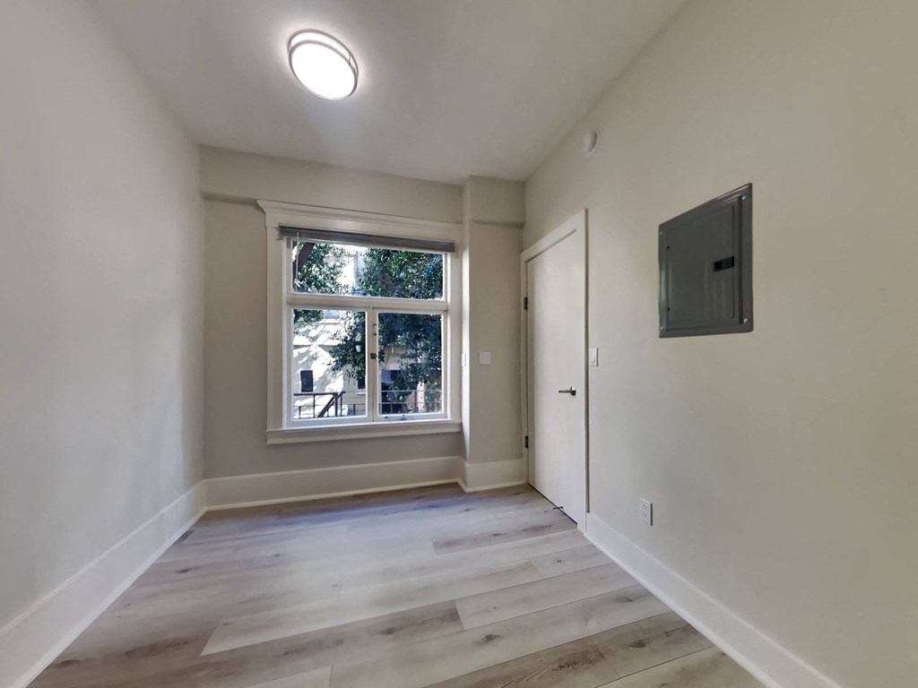 a living room with a window and a door