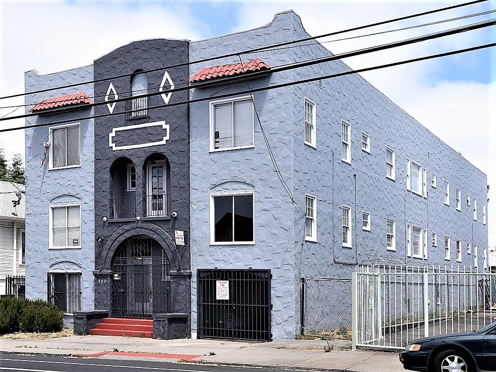 a blue building on the side of a street