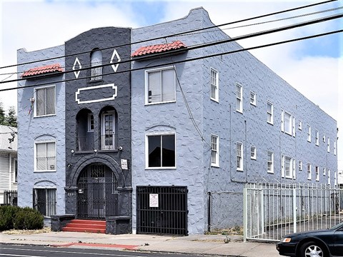 a blue building on the side of a street