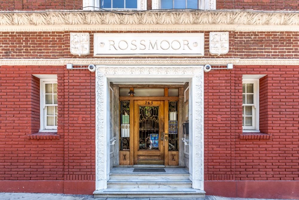 the front of a red brick building with a wooden door
