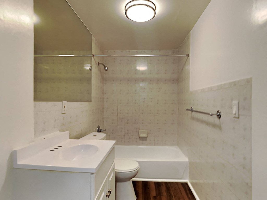 a bathroom with a sink toilet and a tub