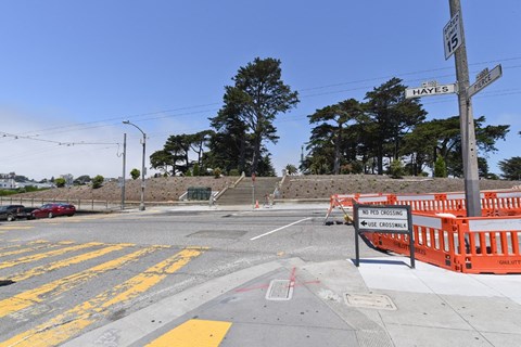 a construction site at the corner of a street with stairs