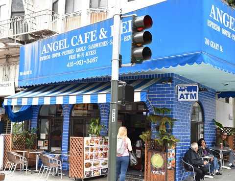 the facade of angel cafe and tea on the corner of a city street