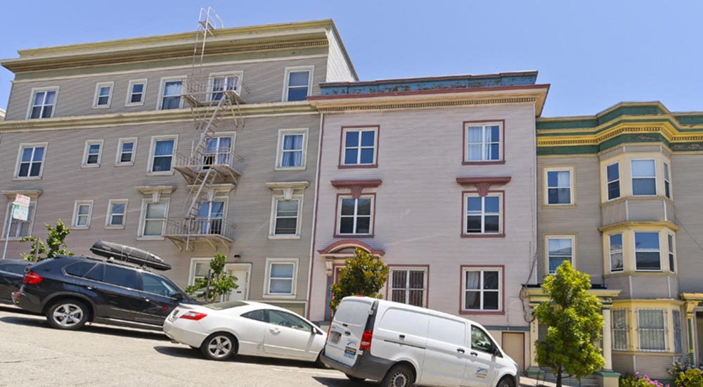 a building with cars parked in front of it