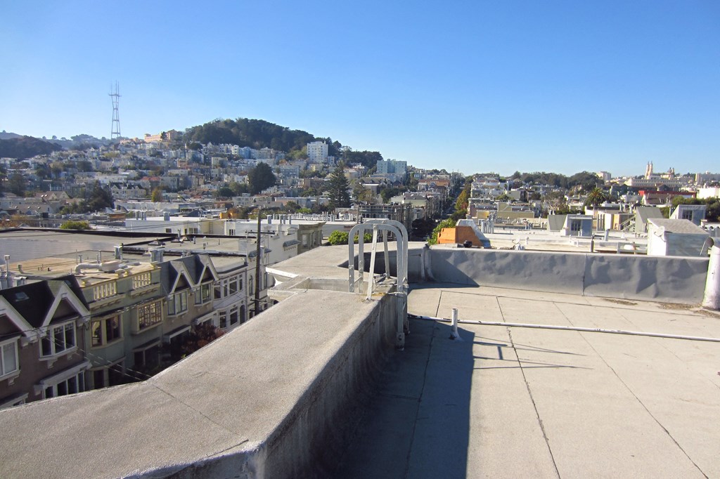a view of the city from the top of a roof