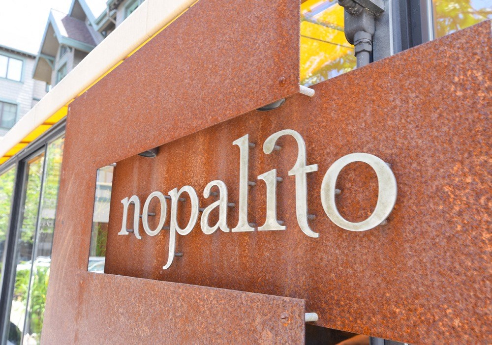 a sign on the side of a building that says