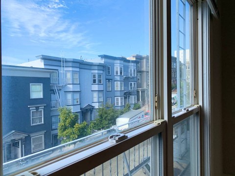 the view out of a window of an apartment building