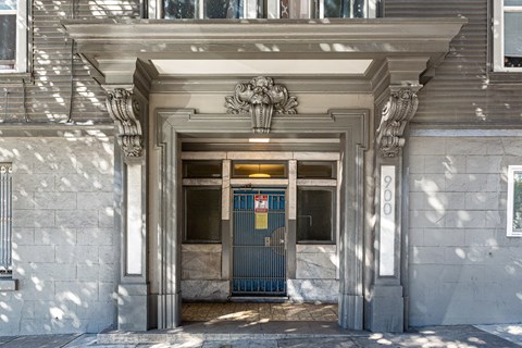 the entrance to a building with a blue door