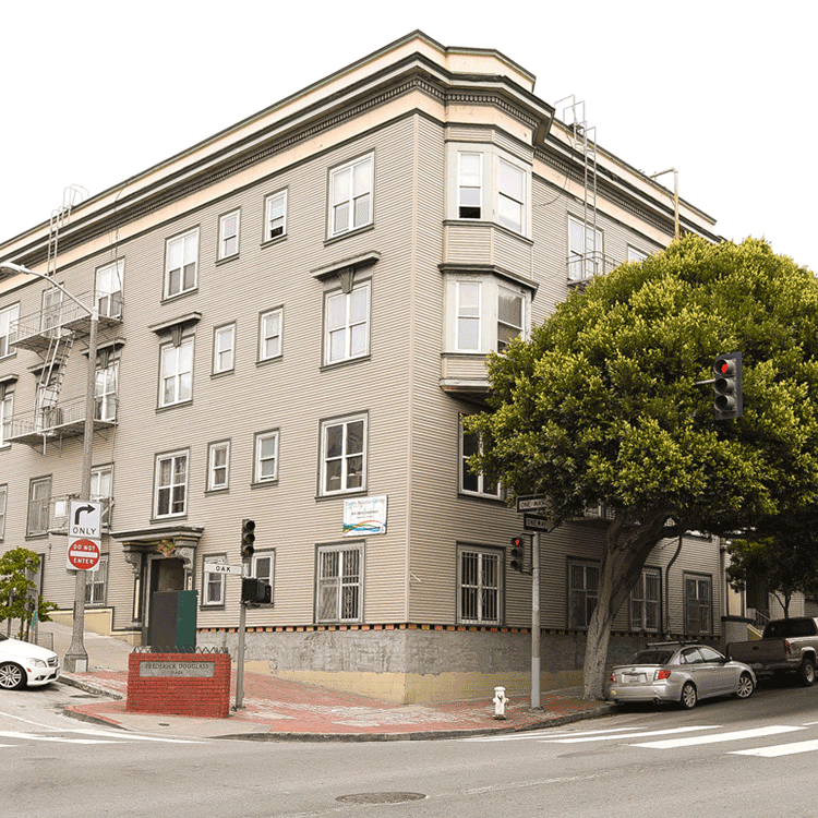 a building on the corner of a city street