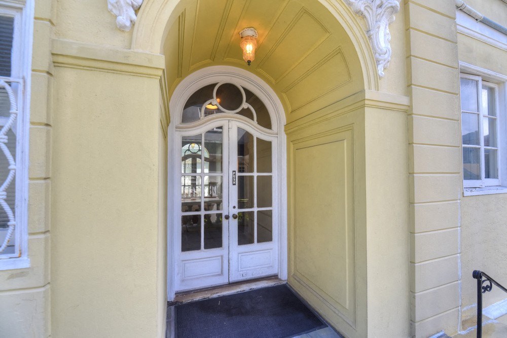 the entrance of a building with a white door