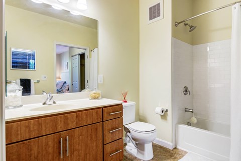 a bathroom with a toilet sink and shower