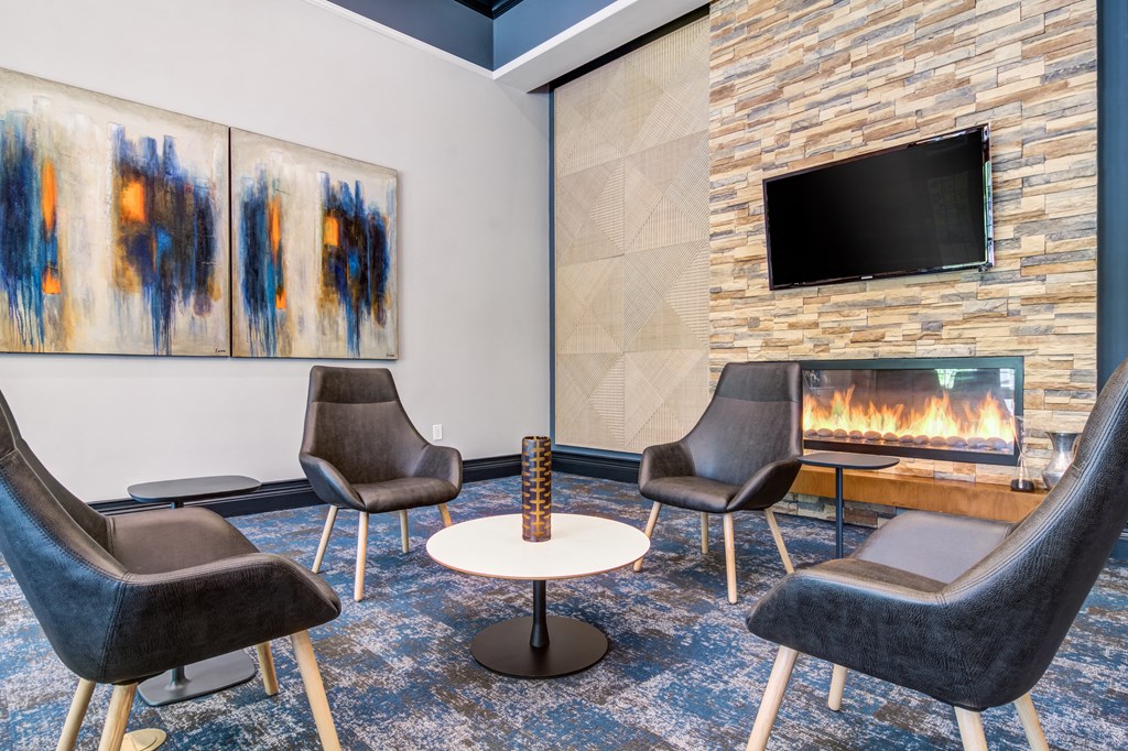 a room with a fireplace and a tv