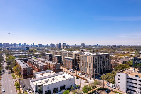 A cityscape with buildings and a clear blue sky.