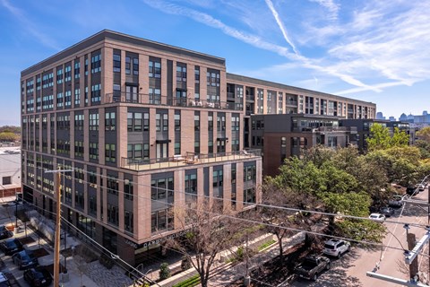 A large building with a parking lot in front of it.